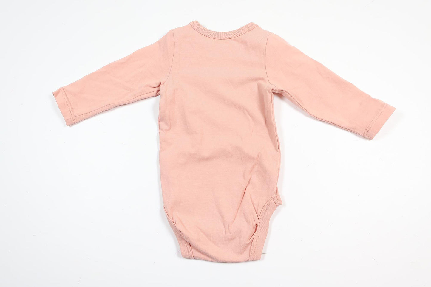 Rosa långärmad body från Lindex i storlek 56