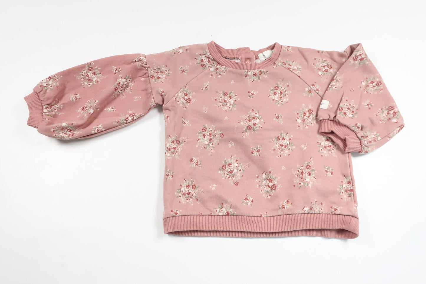 Blommig sweatshirt med ballongärmar från Newbie - Storlek 74 - Rosa