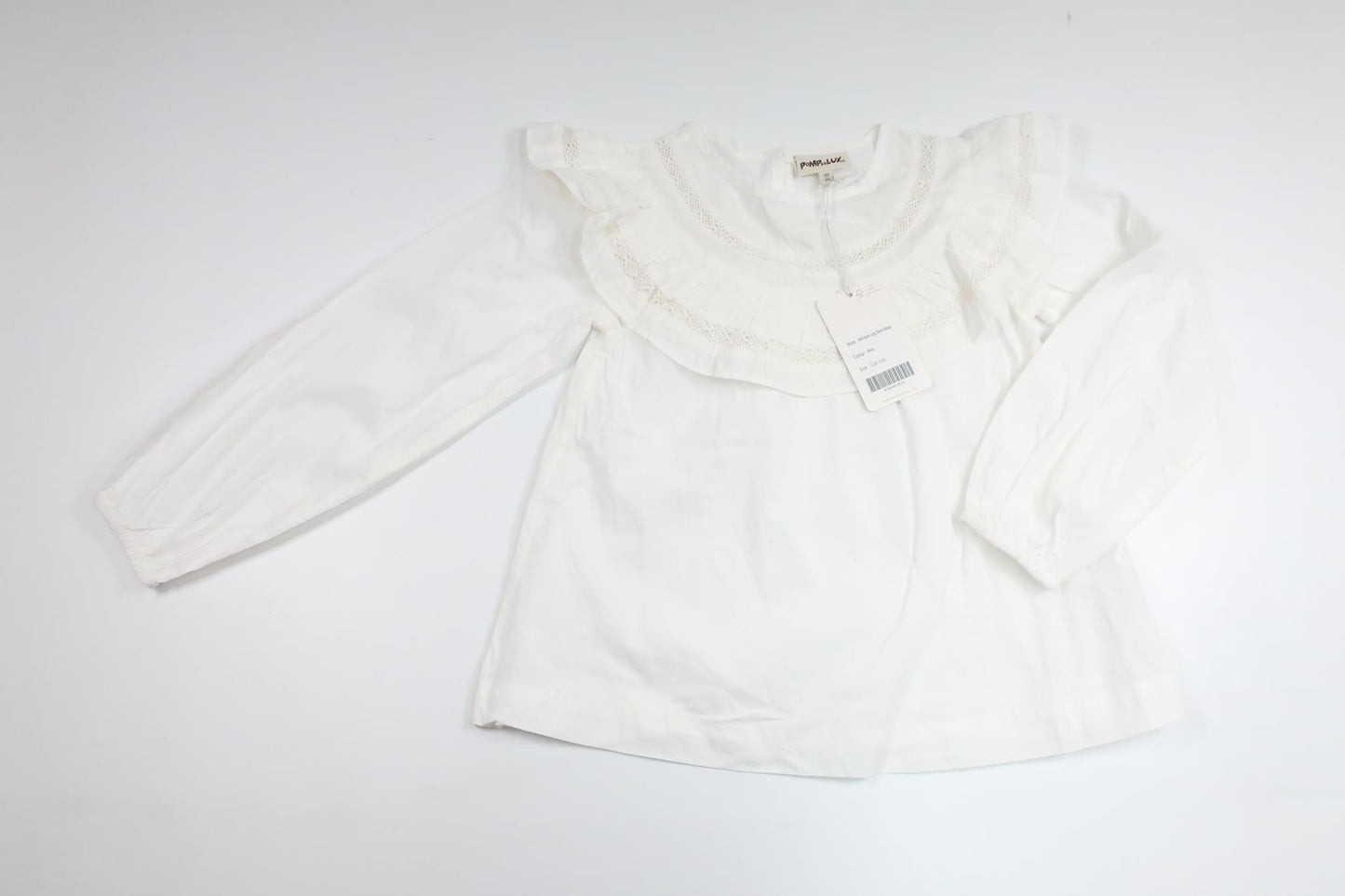 Blus med volang från PompdeLux - Storlek 110/116 - Vit
