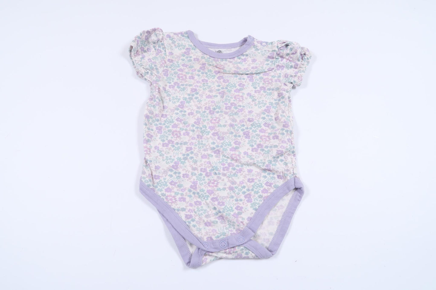 Blommig body från Mini Mow i storlek 62/68