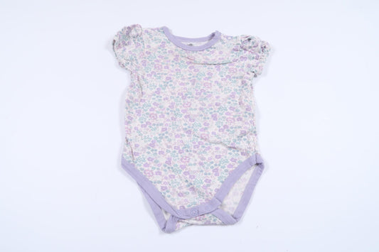 Blommig body från Mini Mow i storlek 62/68