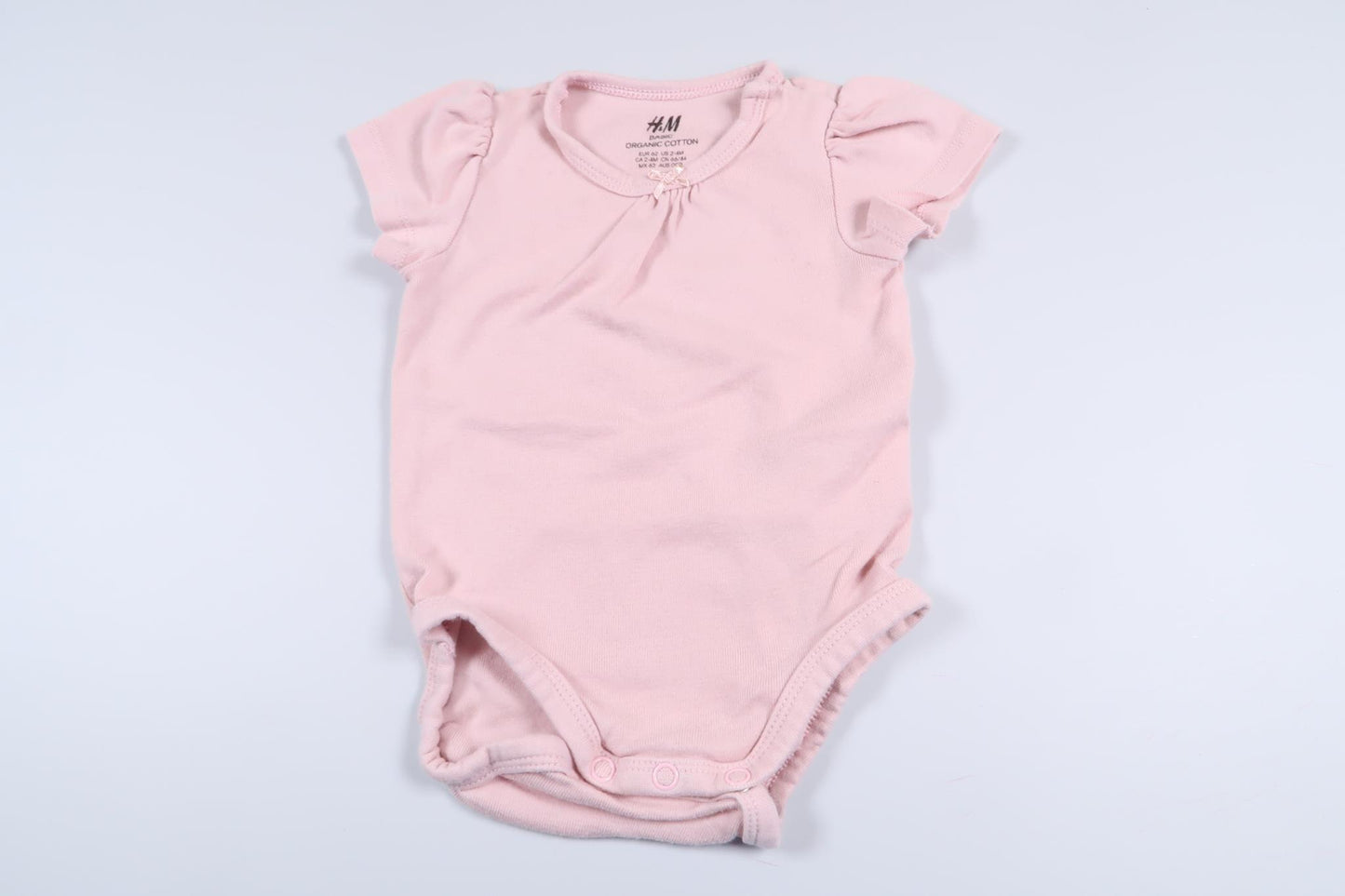 Rosa body från H&M i storlek 62