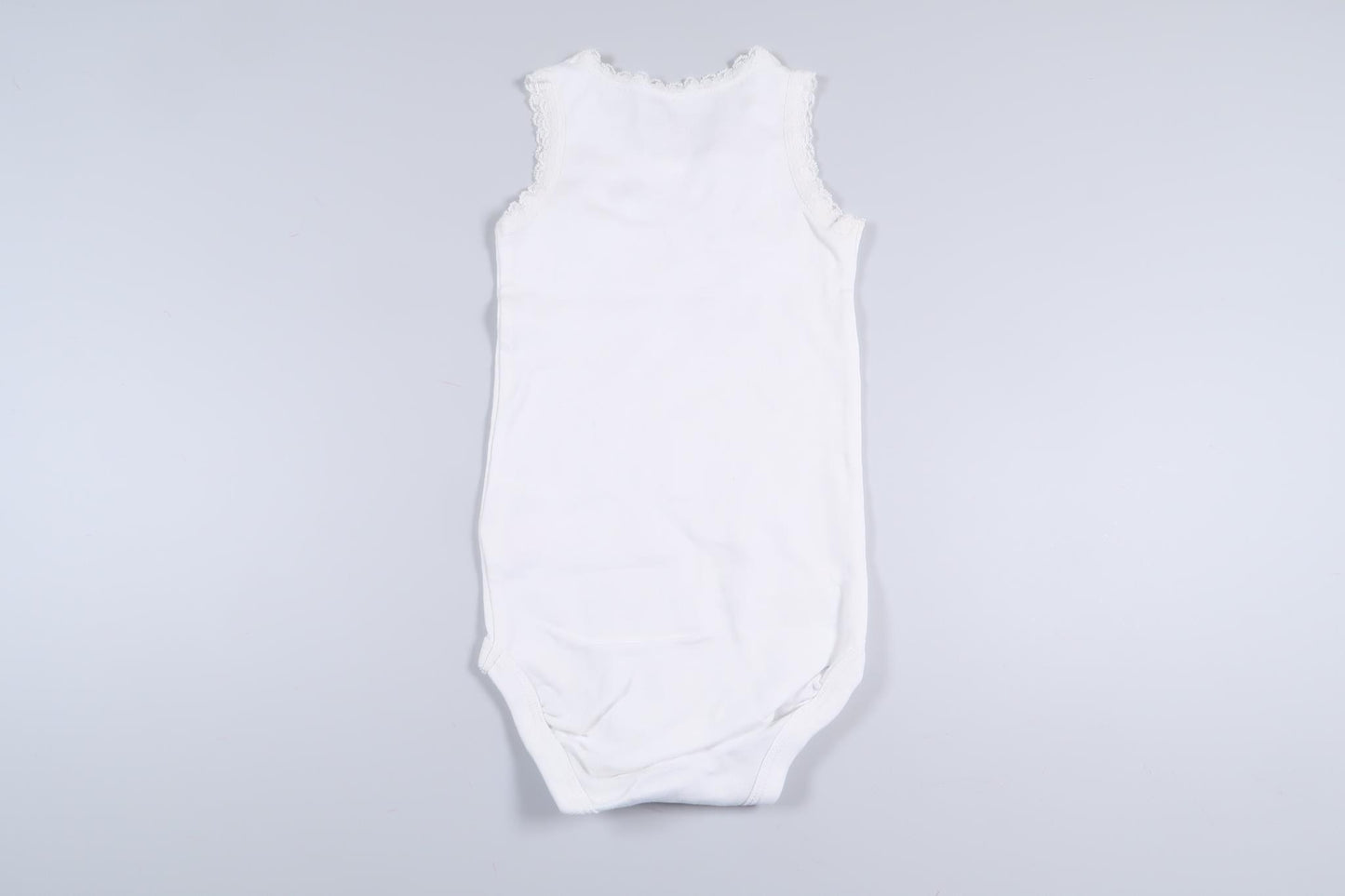 Nyskick! Vit linnebody från Lindex i storlek 80