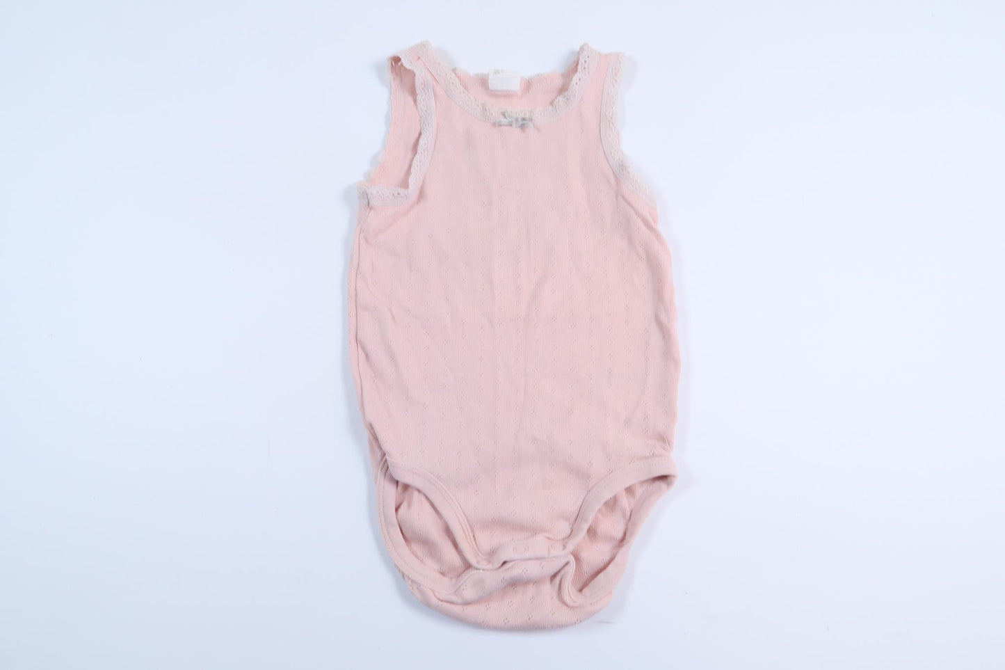 Rosa linnebody från H&M i storlek 80