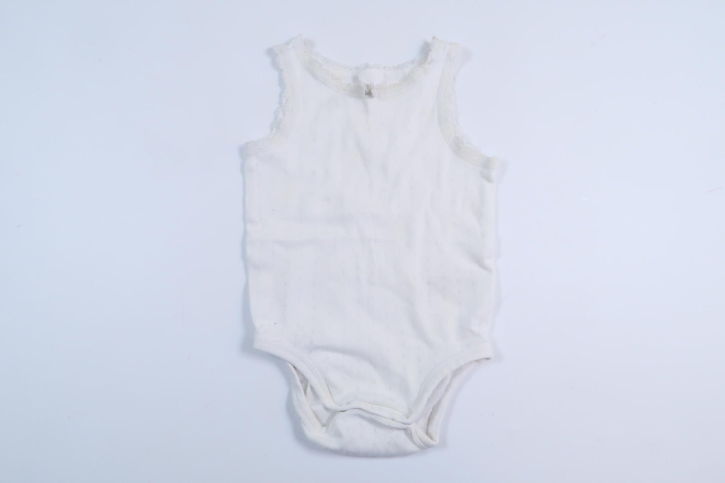 Vit linnebody från H&M i storlek 80