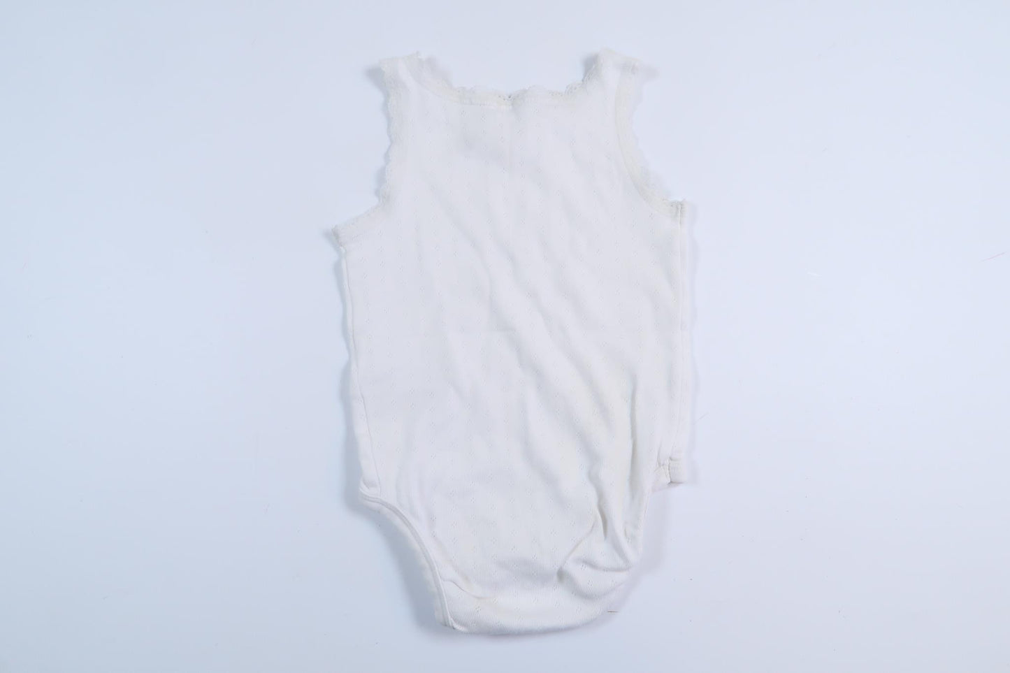 Vit linnebody från H&M i storlek 80