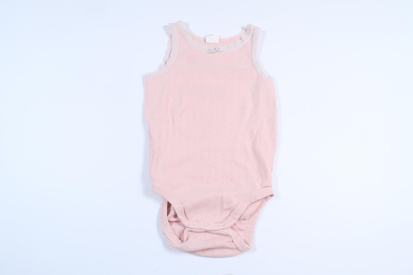 Rosa linnebody från H&M i storlek 80