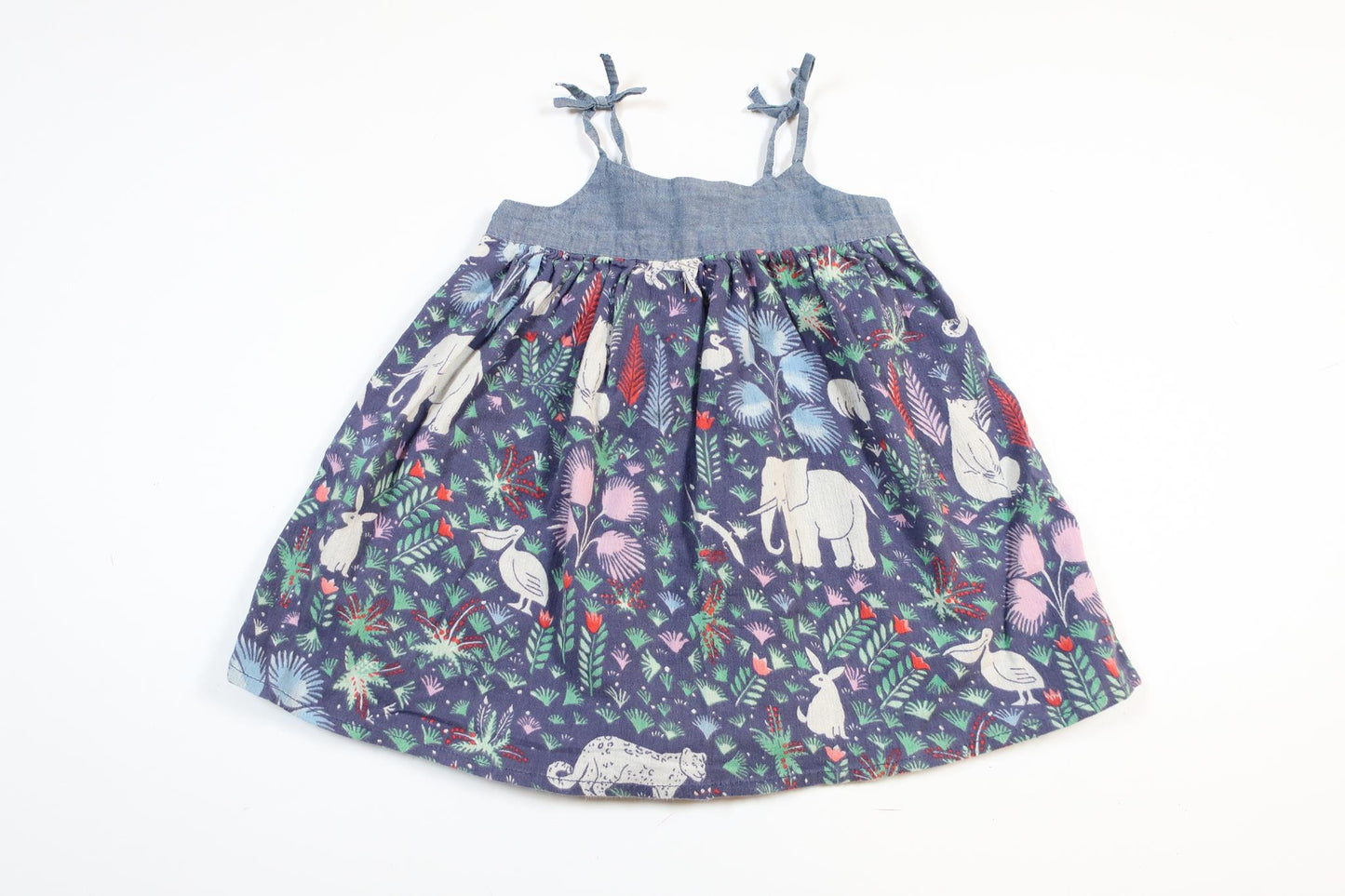 Blå klänning med skogsmotiv från Baby GAP i storlek 80