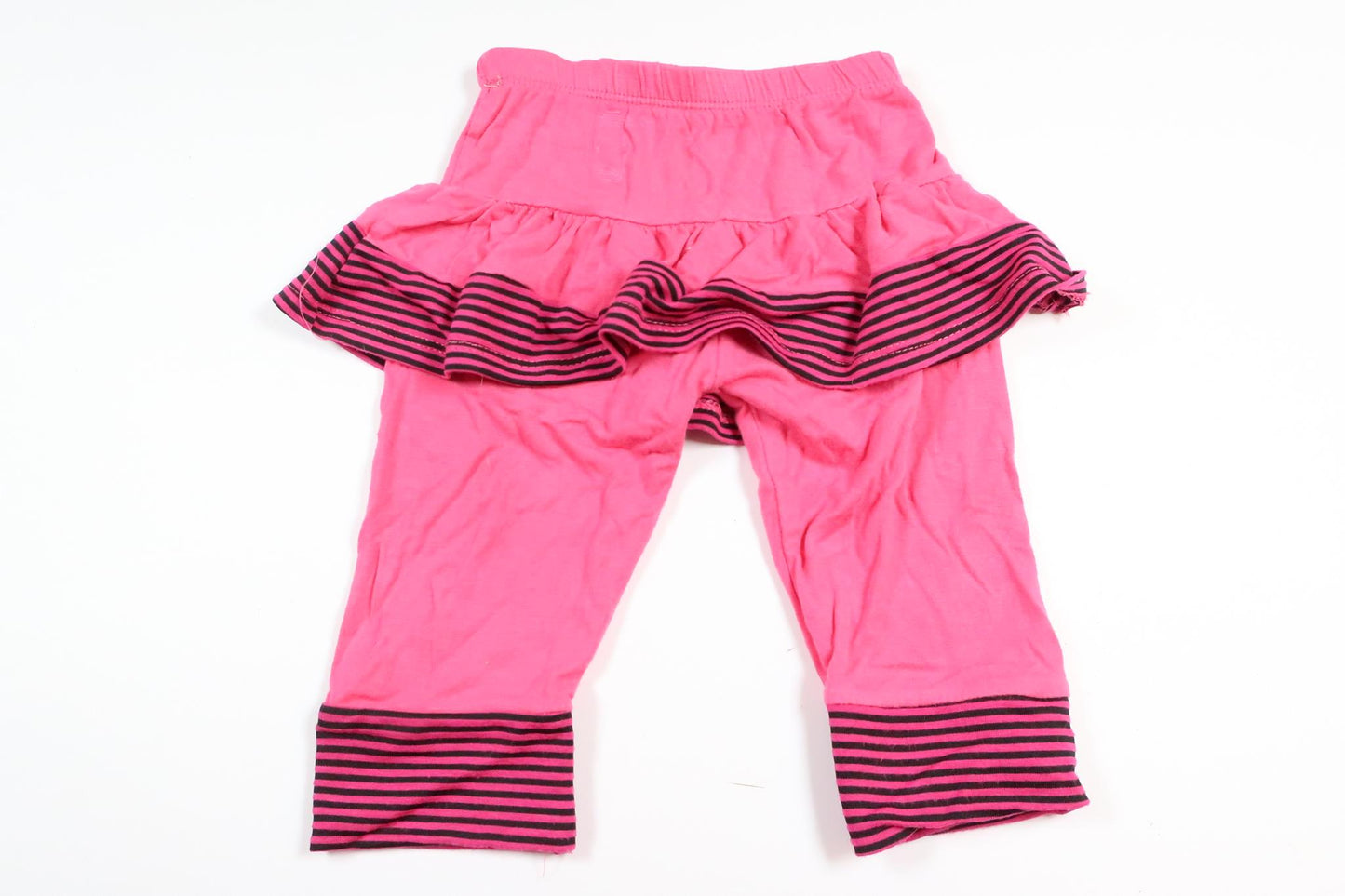 Rosa byxor med inbyggd kjol i storlek 68/74