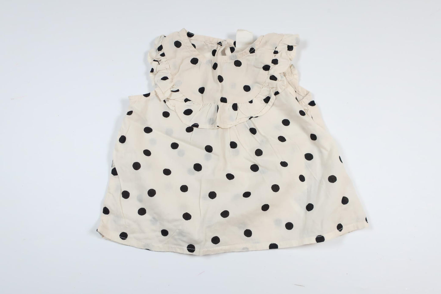 Benvit prickig tunika från H&M i storlek 68