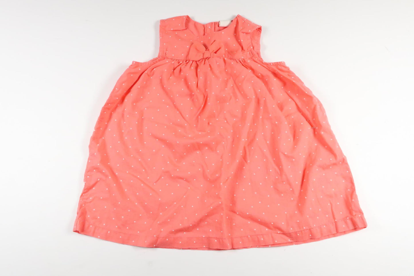 Neonrosa prickig klänning från H&M i storlek 80
