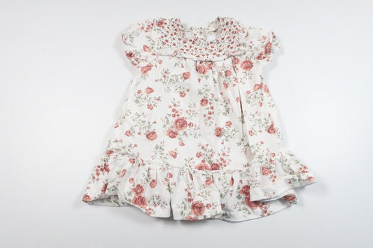 Blommig klänning från Newbie - Storlek 74 - Vit