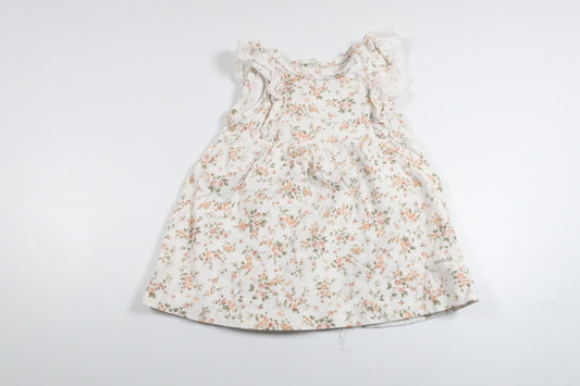 Blommig klänning från Newbie - Storlek 62 - Vit