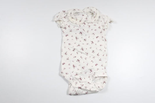 Blommig body från Newbie - Storlek 68 - Vit