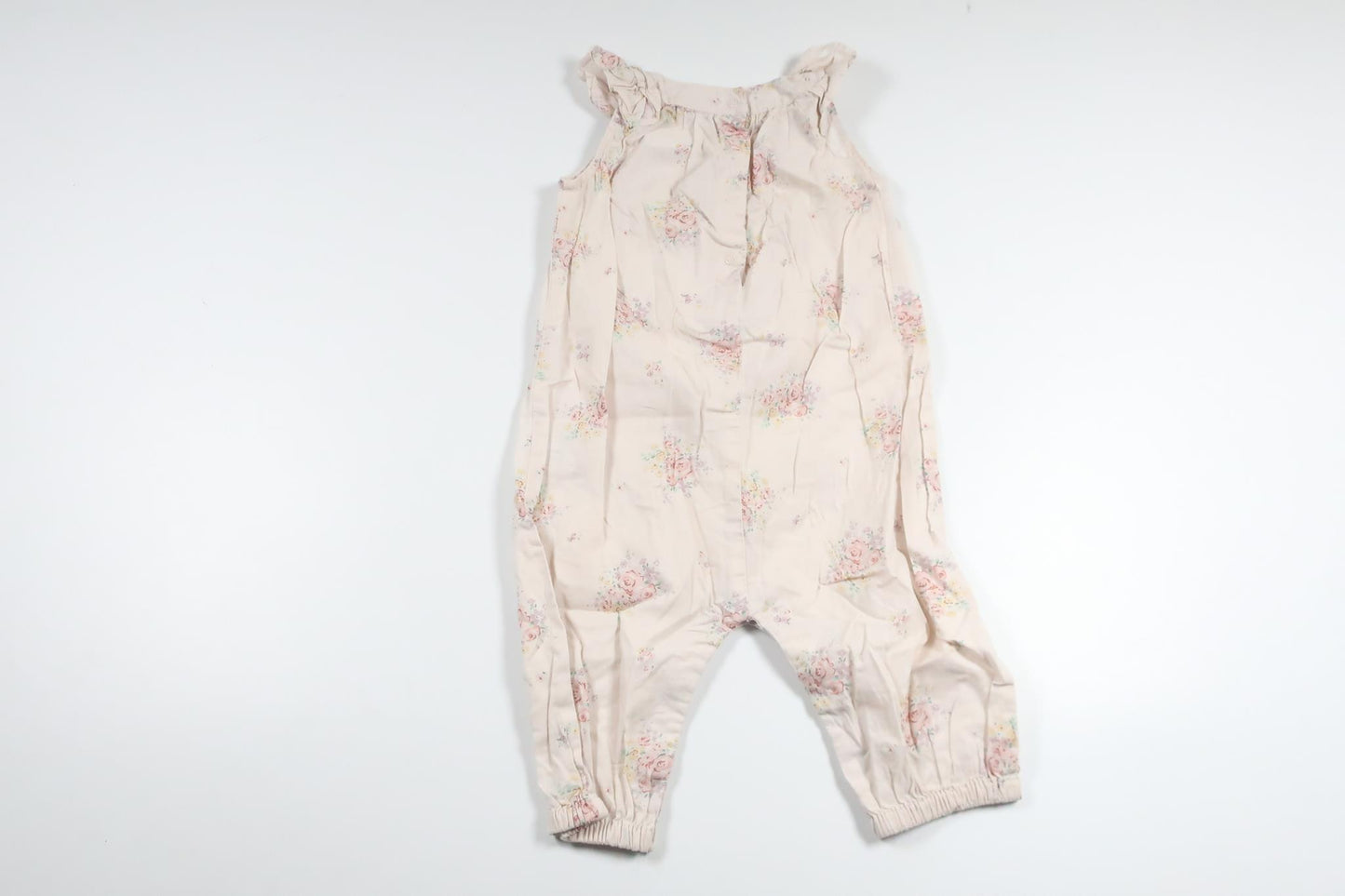 Blommig jumpsuit från Newbie - Storlek 74 - Rosa