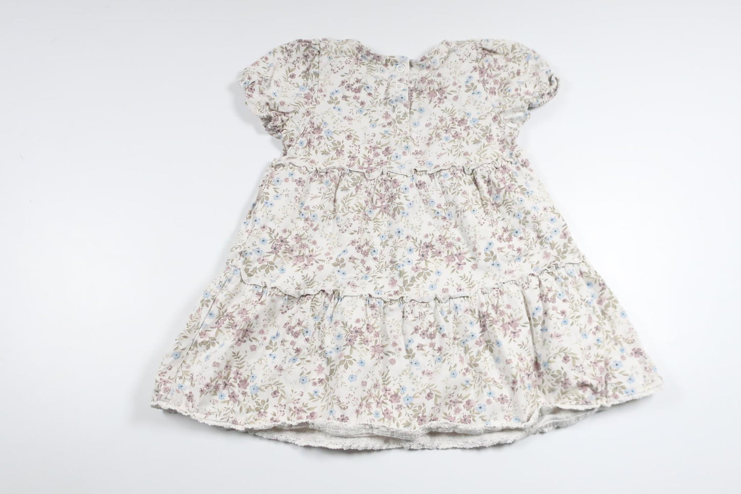 Blommig klänning från Newbie - Storlek 86 - Vit