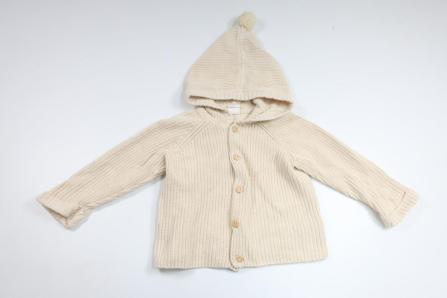 Stickad munkjacka med tofs från H&M - Storlek 86 - Benvit