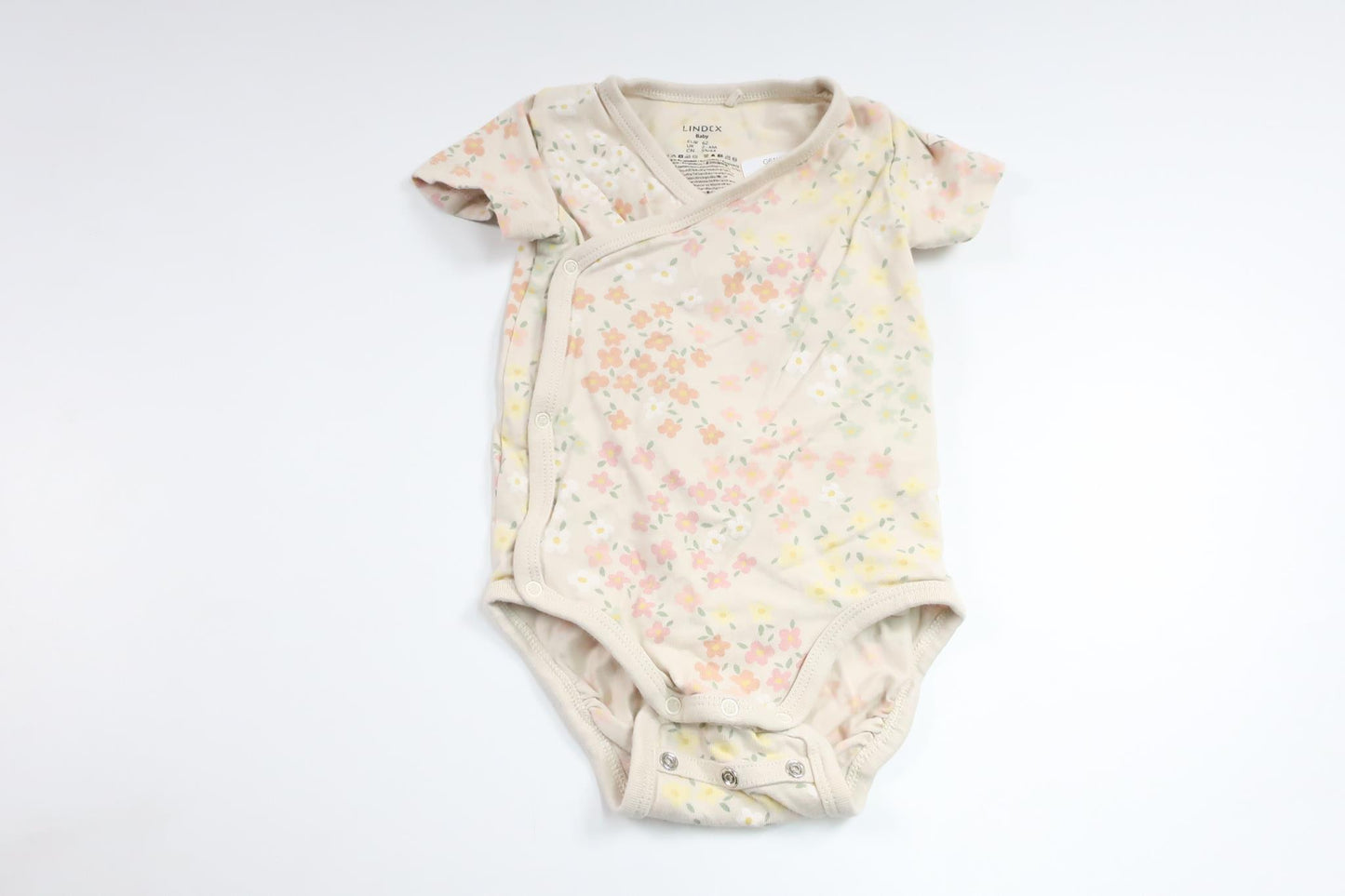 Blommig omlottbody från Lindex - Storlek 62 - Benvit