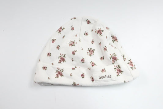 Blommig mössa från Newbie - Storlek 50/56 - Vit
