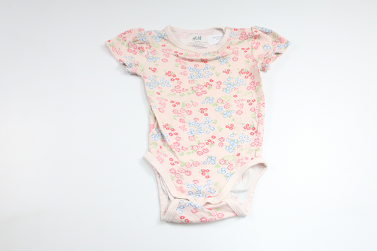 Blommig body från H&M - Storlek 74 - Rosa
