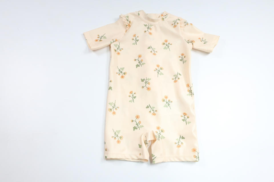 Blommig UV-dräkt från H&M - Storlek 62/68 - Gul