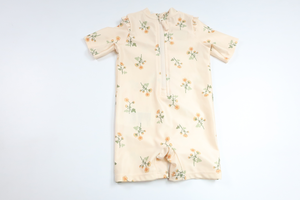 Blommig UV-dräkt från H&M - Storlek 62/68 - Gul