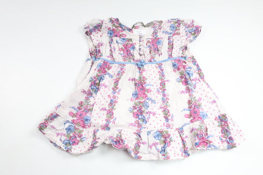 Blommig tunika från Lindex - Storlek 104 - Vit