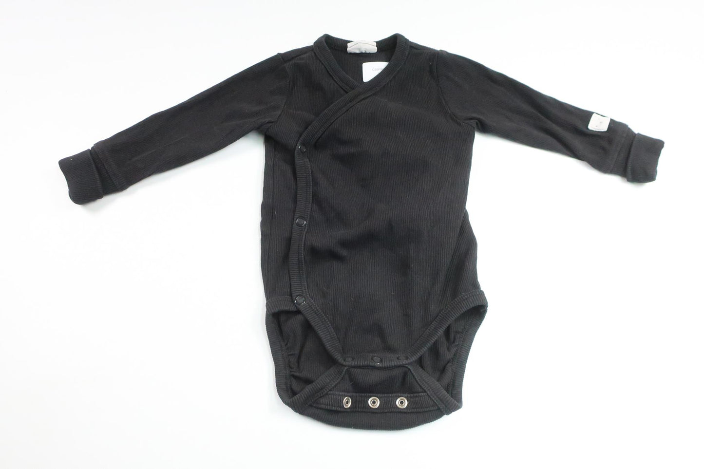 Ribbad omlottbody från Kappahl - Storlek 68 - Svart