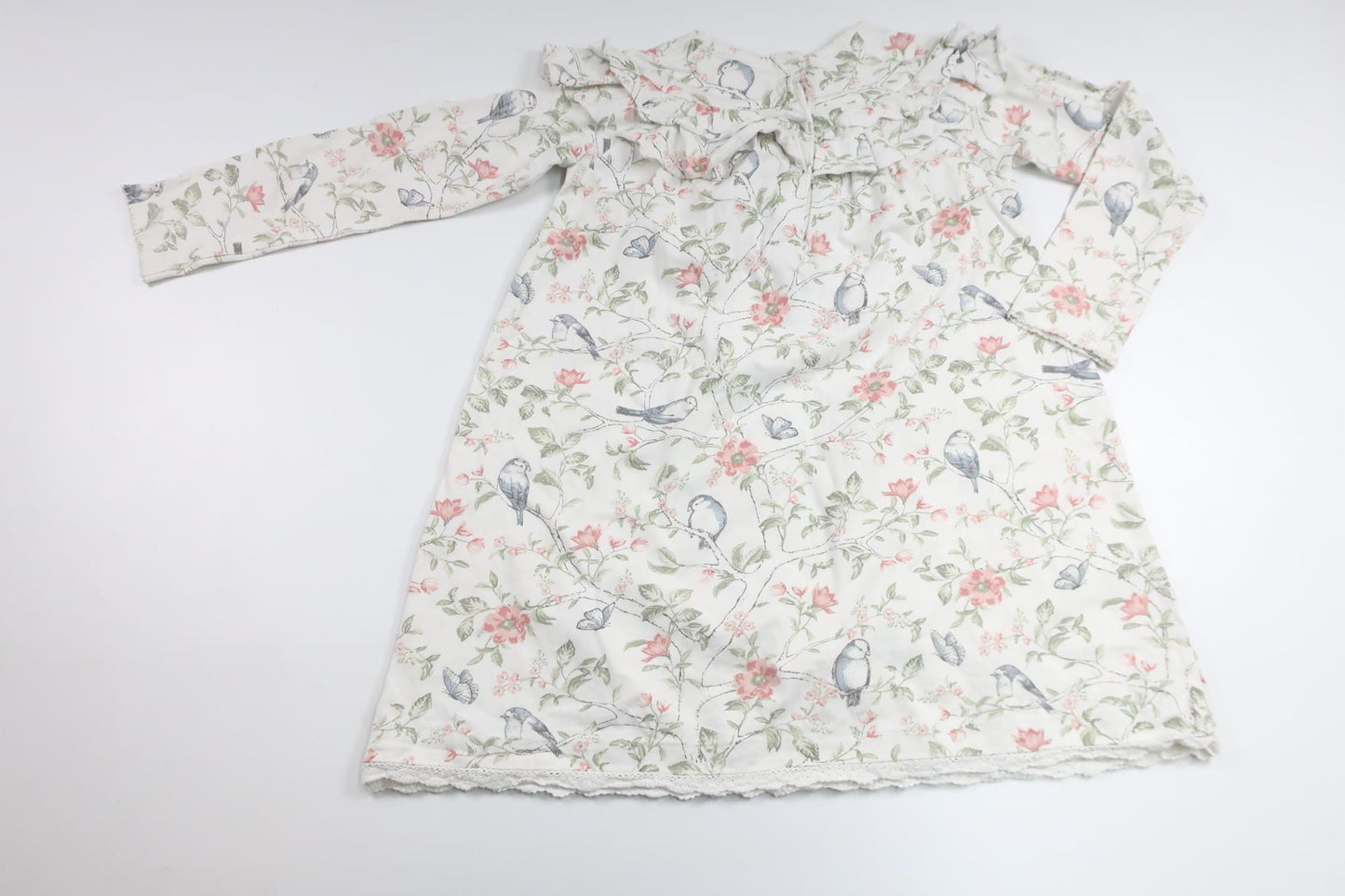 Blommig klänning från Newbie - Storlek 116 - Vit