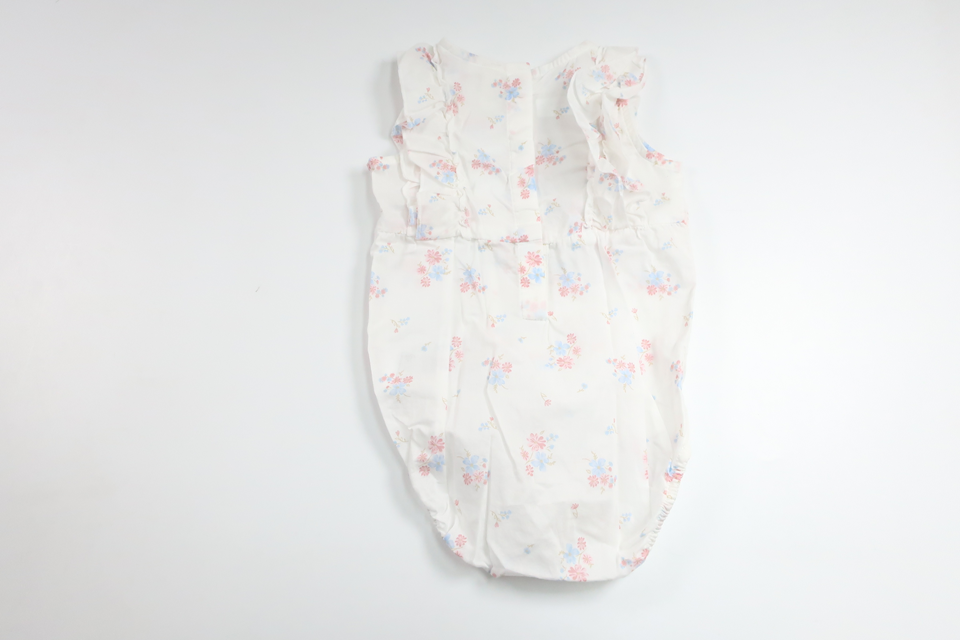 Blommig body med volang från H&M - Storlek 80 - Vit