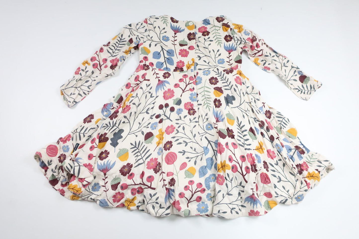 Blommig snurrklänning från Polarn o. Pyret - Storlek 104 - Benvit