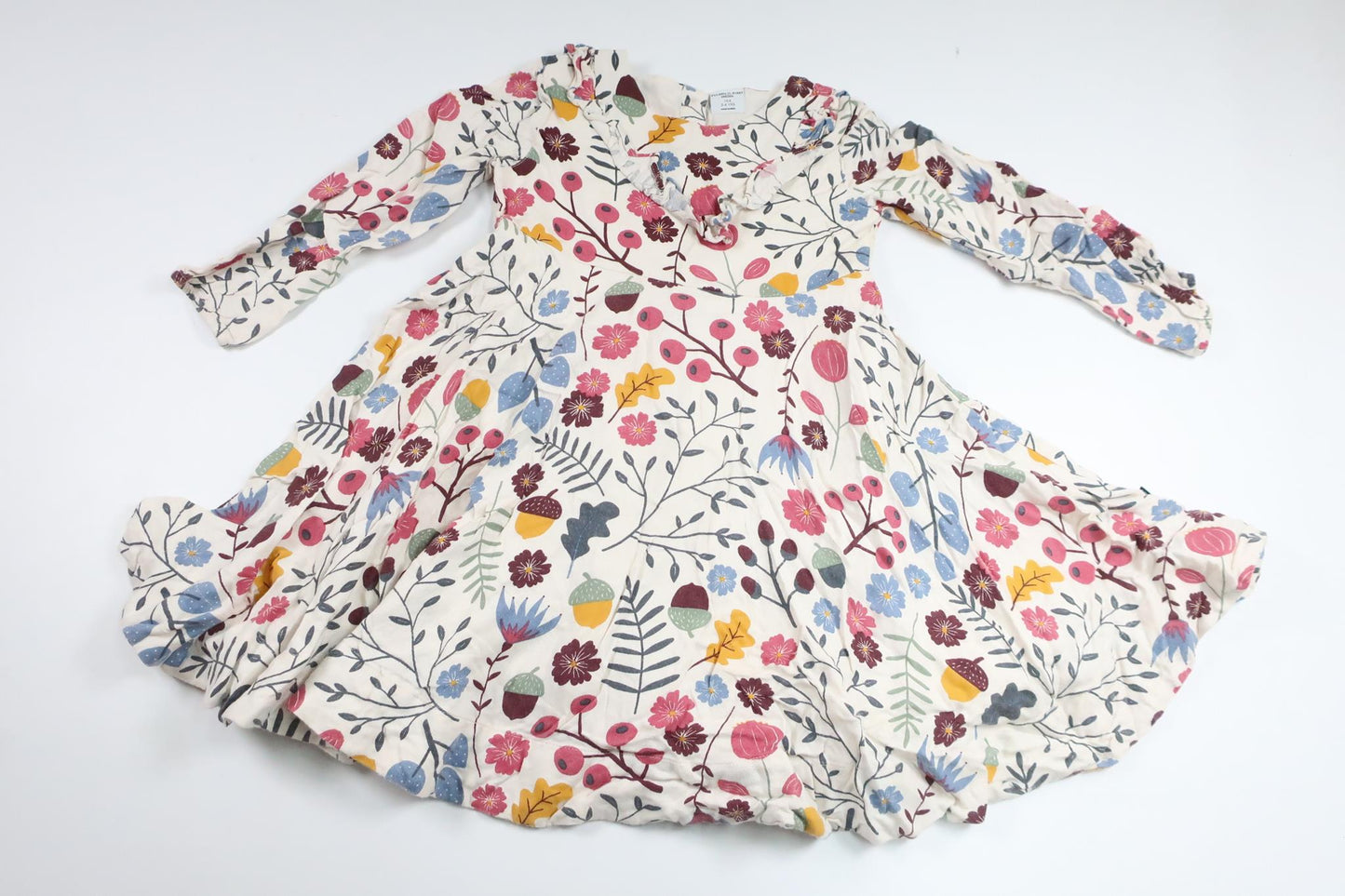 Blommig snurrklänning från Polarn o. Pyret - Storlek 104 - Benvit