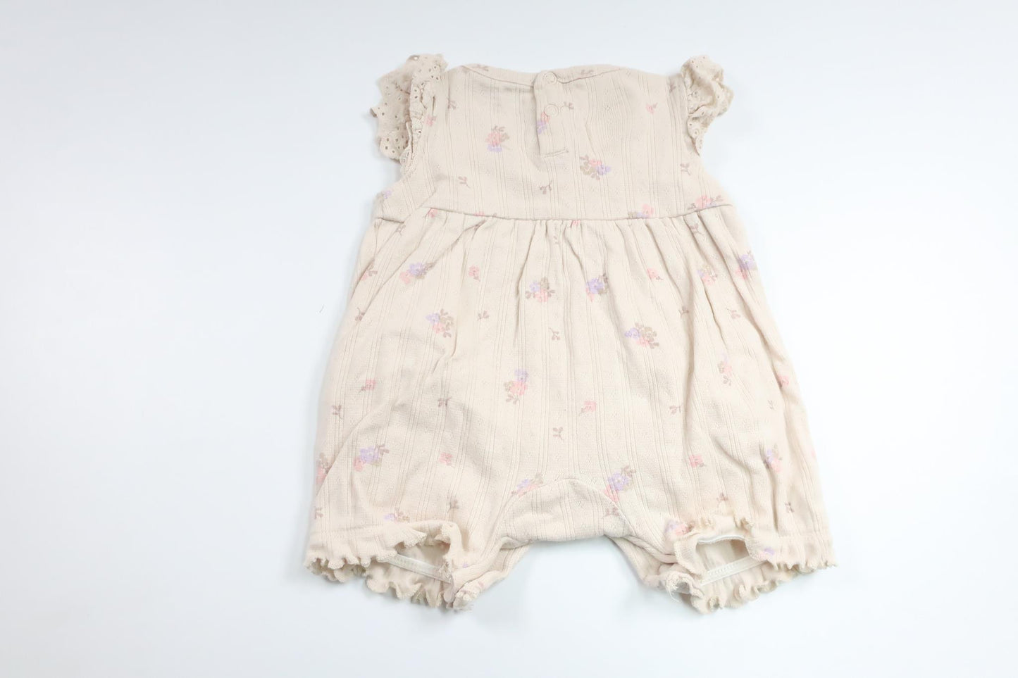 Blommig jumpsuit från Tiny One - Storlek 50 - Benvit