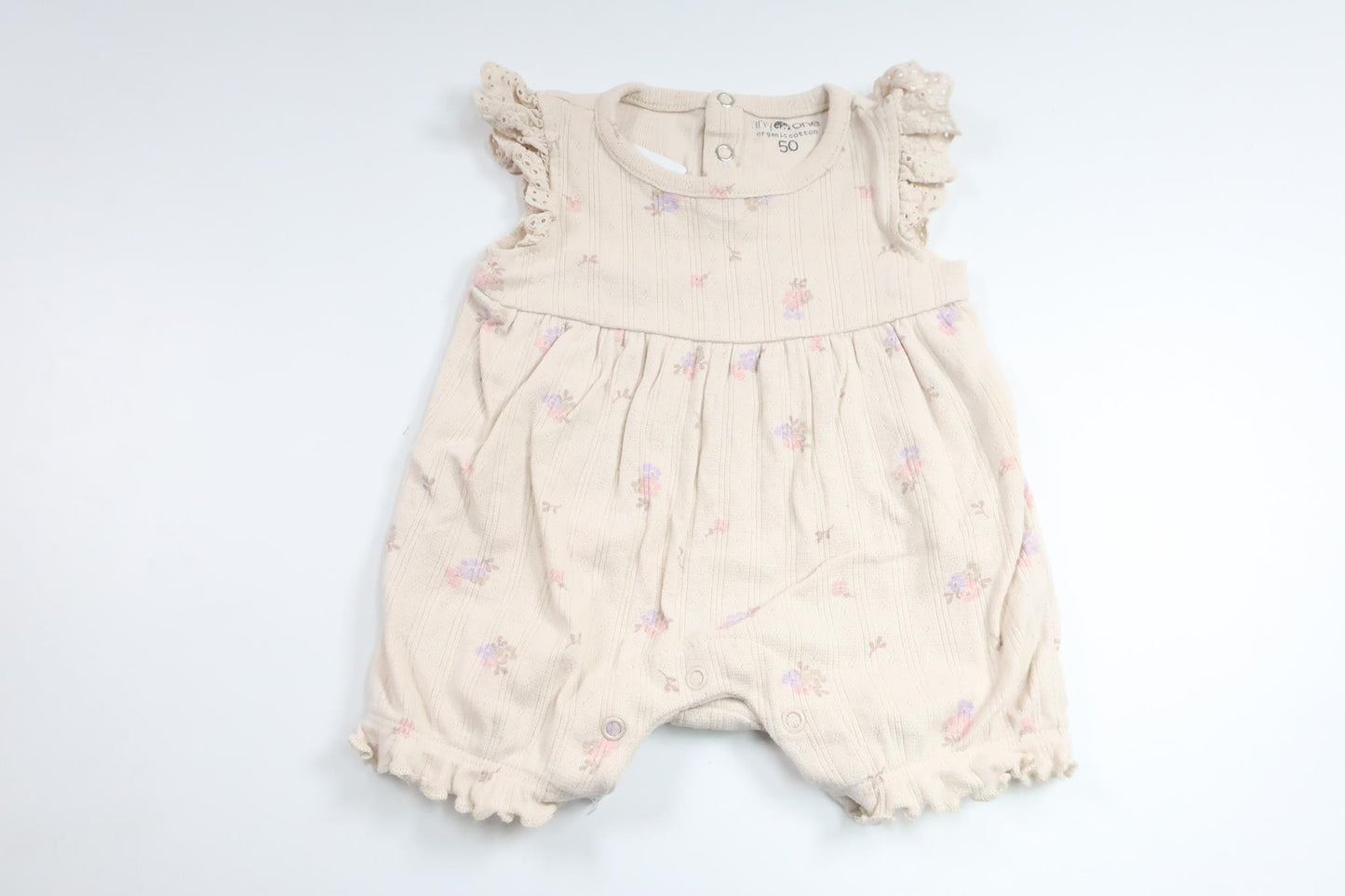 Blommig jumpsuit från Tiny One - Storlek 50 - Benvit