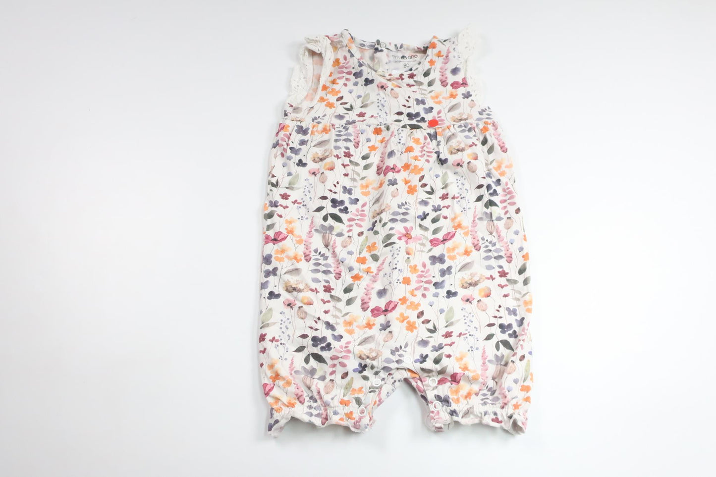 Blommig jumpsuit från Tiny One - Storlek 80 - Vit