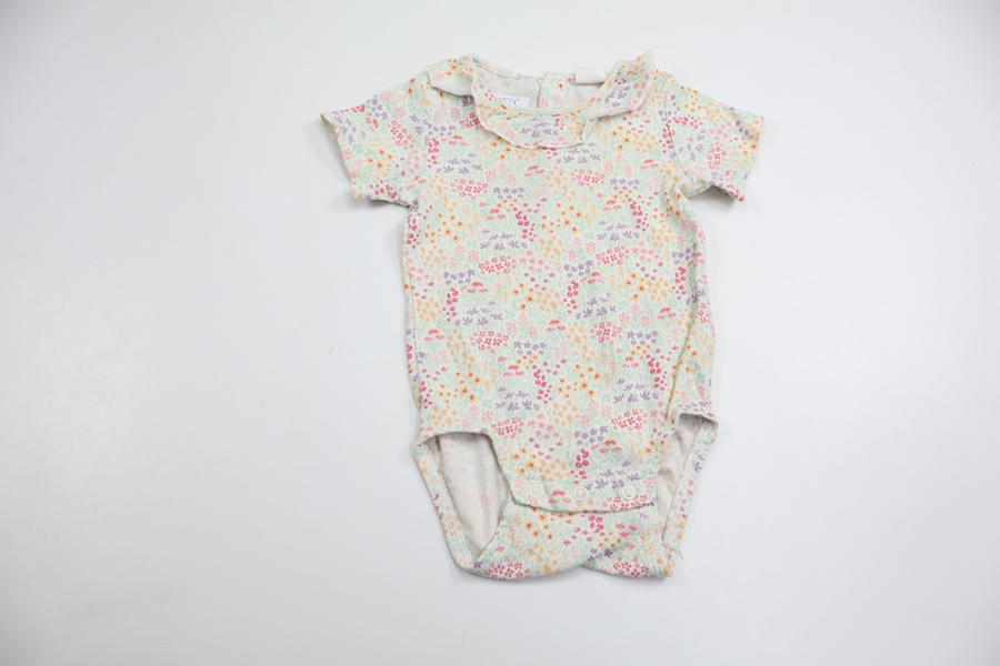 Blommig body med volang från H&M - Storlek 74 - Multi