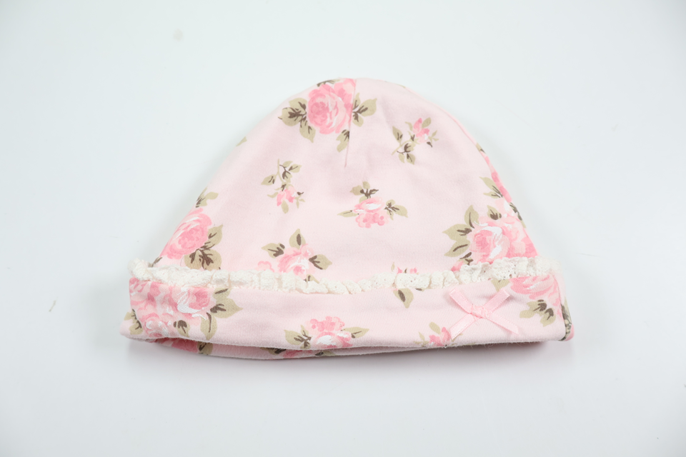 Blommig mössa från Okänt - Storlek 62/68 - Rosa
