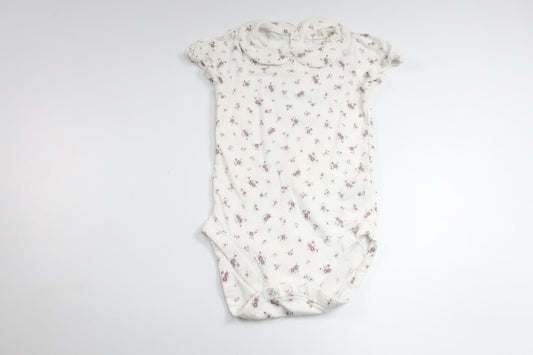 Body med krage och blommor från Newbie - Storlek 86 - Vit