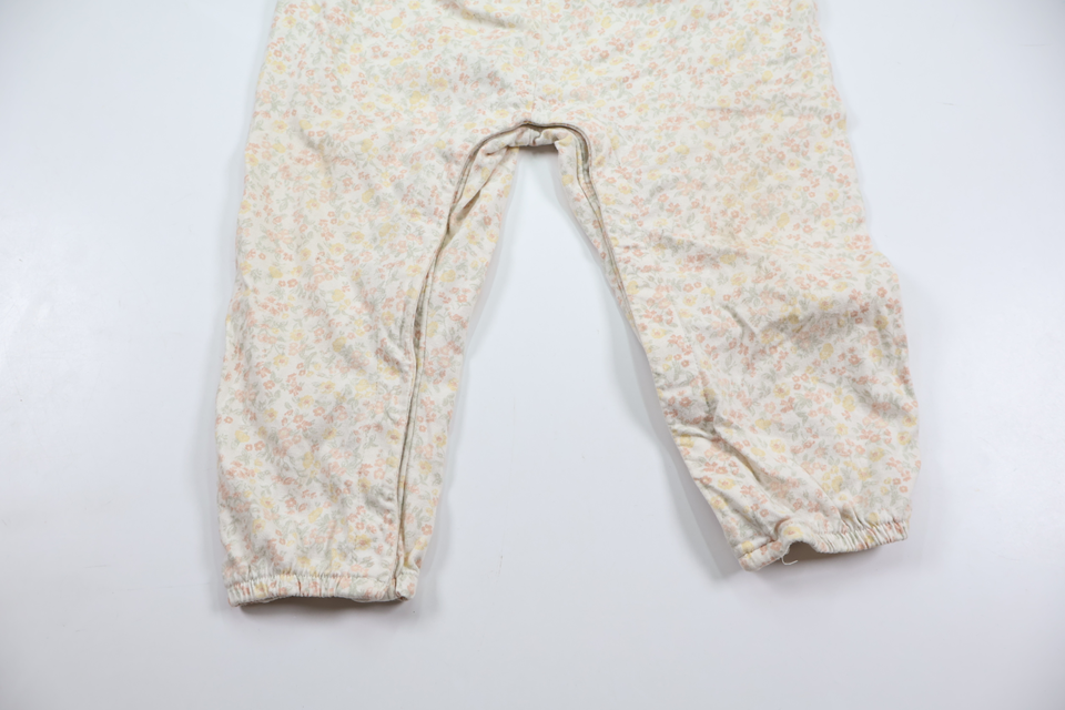 Blommig jumpsuit från Newbie - Storlek 86 - Vit
