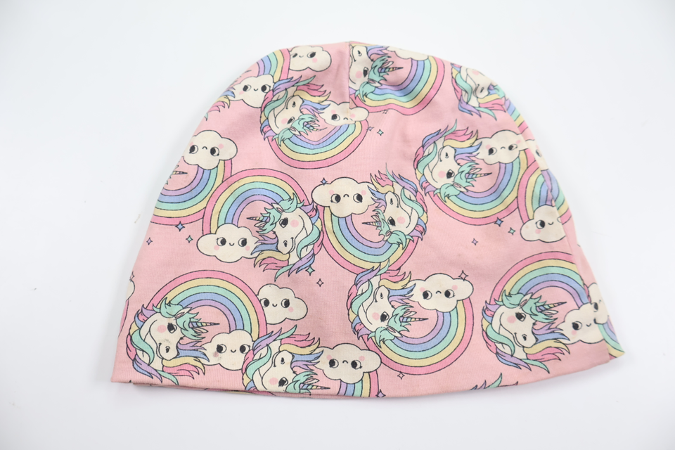 Mössa med enhörningar från Kappahl - Storlek 48/50 - Rosa