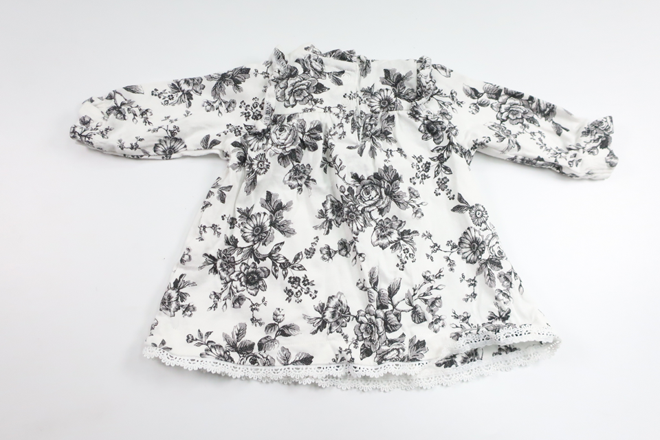 Blommig klänning från Newbie - Storlek 56 - Vit