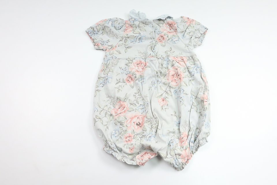 Blommig jumpsuit från Newbie - Storlek 68 - Blå