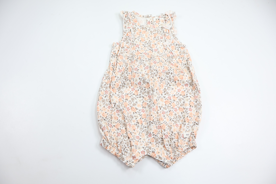 Blommig jumpsuit från Newbie - Storlek 80 - Orange
