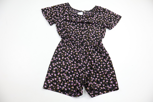 Blommig jumpsuit från Lindex - Storlek 128 - Svart