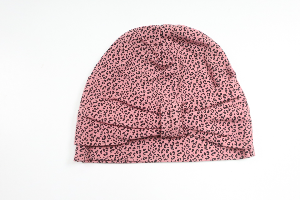 Mössa med rosett från Okänt - Storlek 62/68 - Rosa