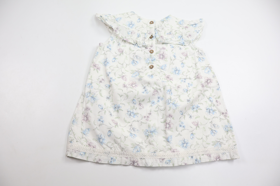 Blommig klänning från Newbie - Storlek 80 - Vit