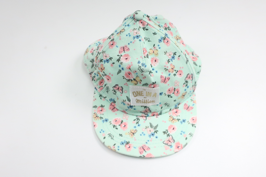 Blommig keps från H&M - Storlek 110/128 - Blå